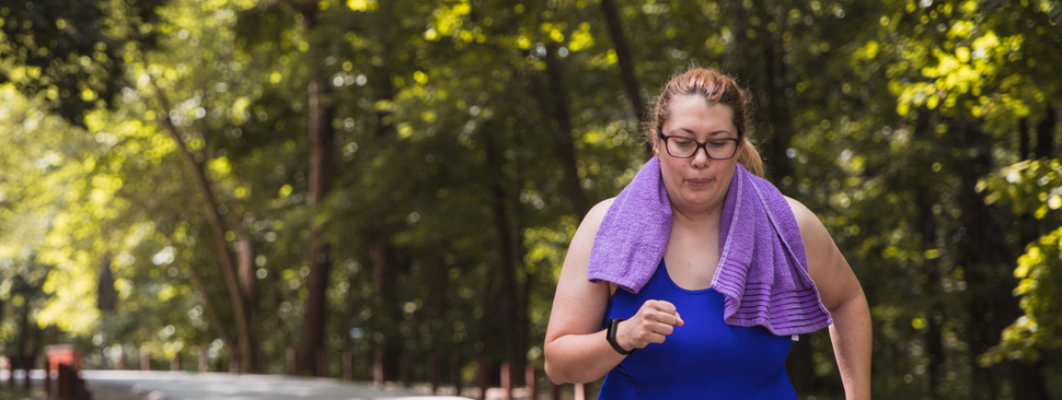 woman exercising on a park path