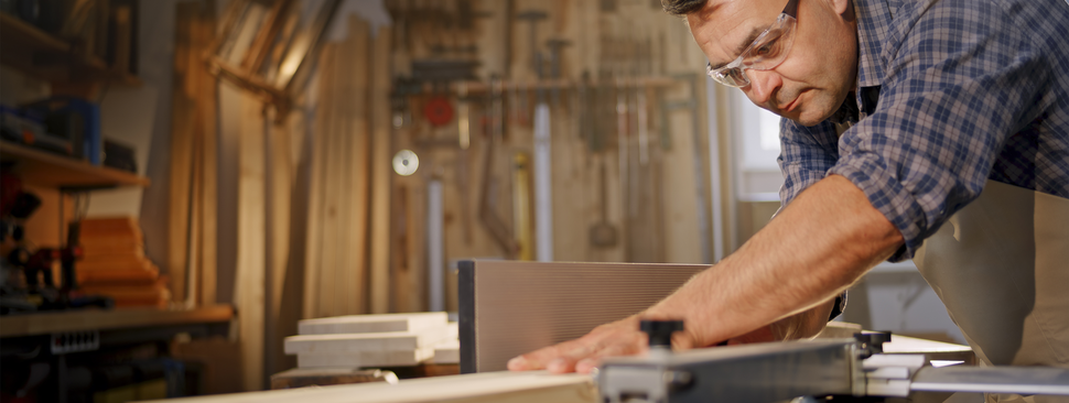 Mature man working in his woodshop