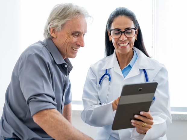 doctor and patient looking at tablet