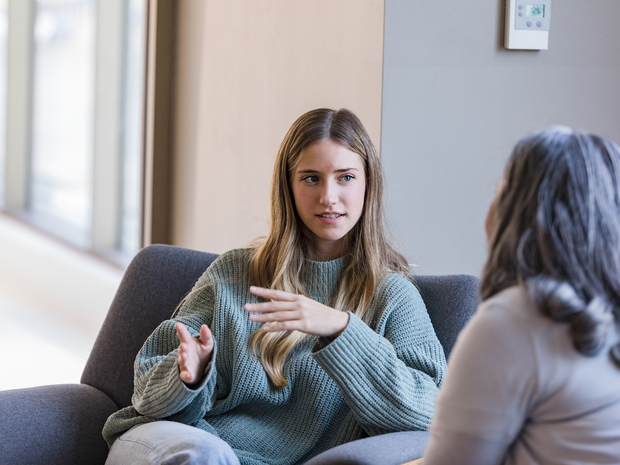 young woman talks to a counselor