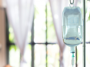 IV bag on a stand in a living room