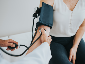 Woman gets blood pressure taken.