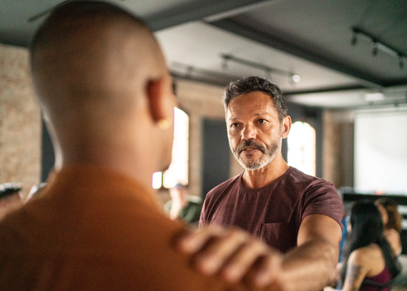 Mature man giving support during a psychotherapy