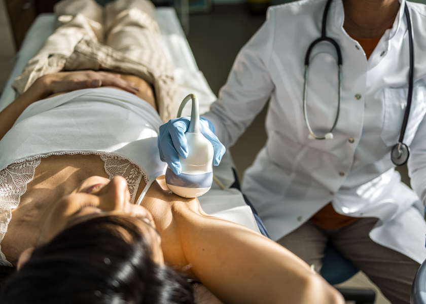 A woman lays as she gets an ultrasound
