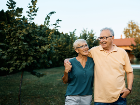 Older couple walking outside together