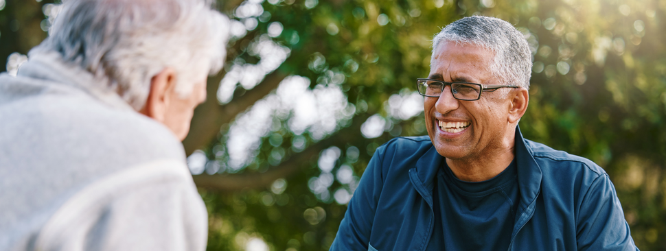 Two older men playing chess