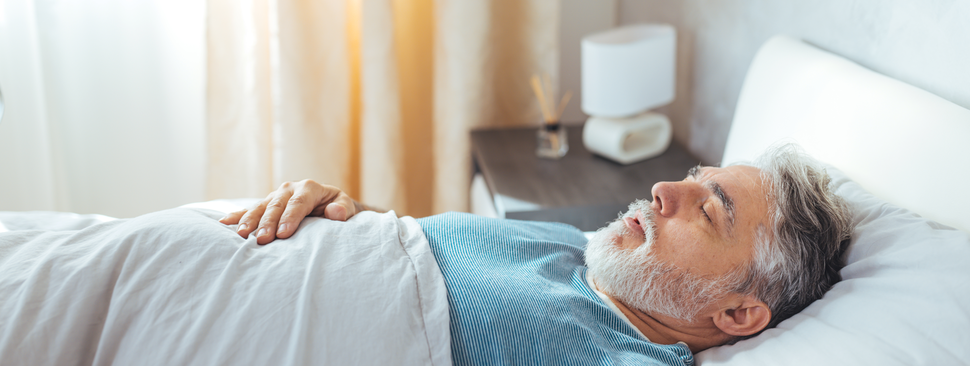 An older man sleeping