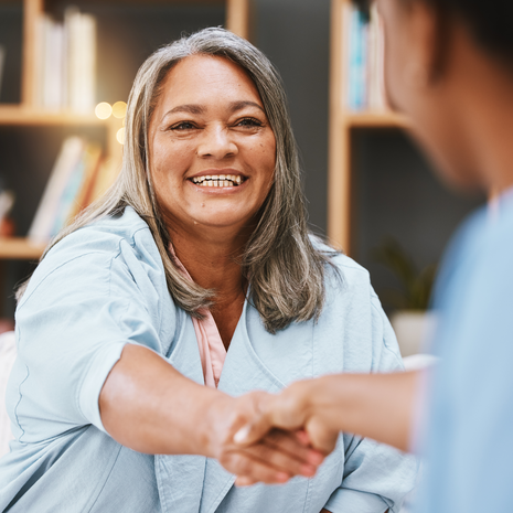 Woman shaking hands with provider