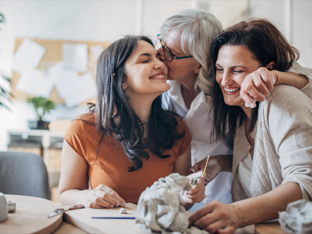 Multi-generation family women doing pottery