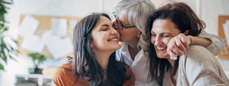 Multi-generation family women doing pottery