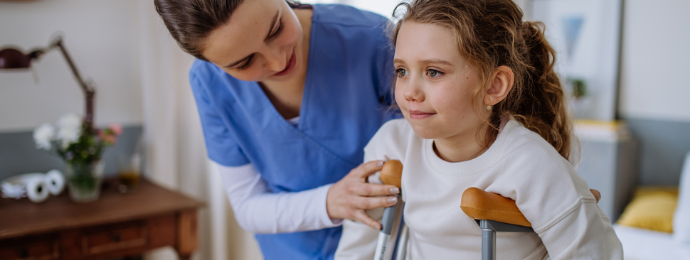 A child sits at a table playing with toys