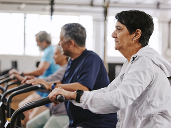 Older people working out in gym.