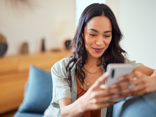 Woman smiling at phone