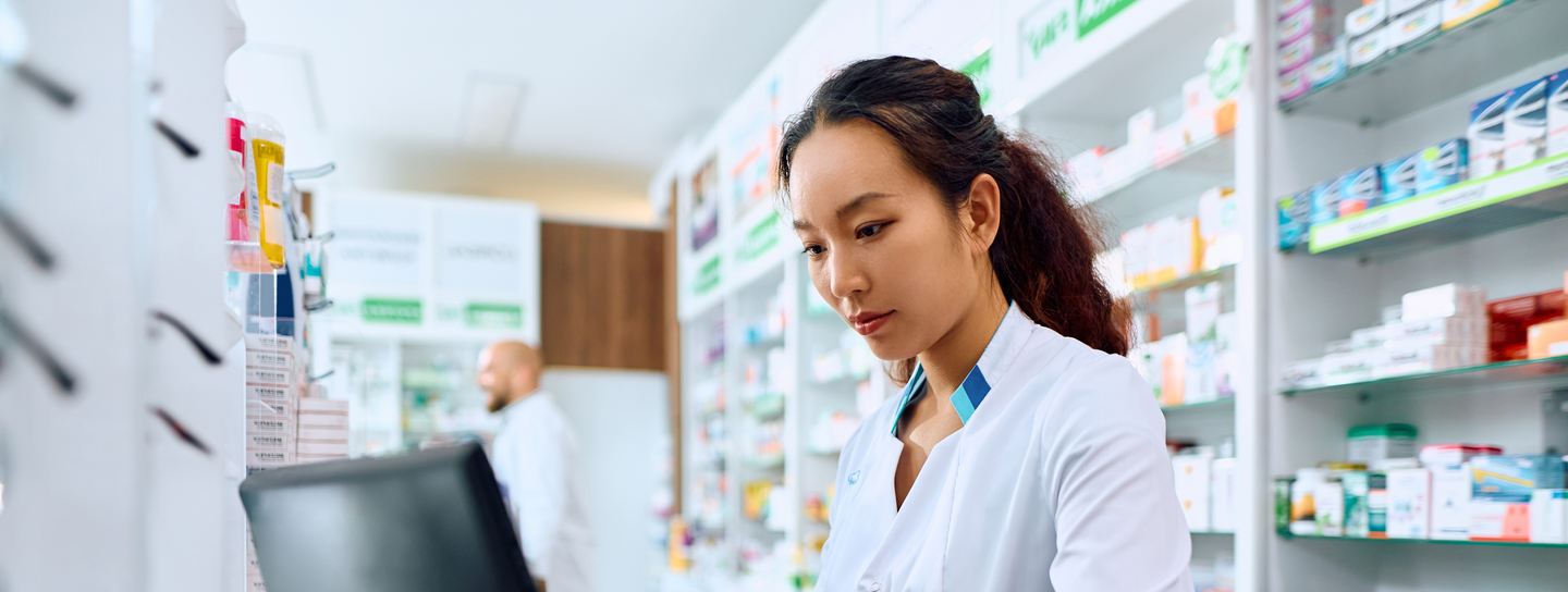 Pharmacy staff working behind the counter