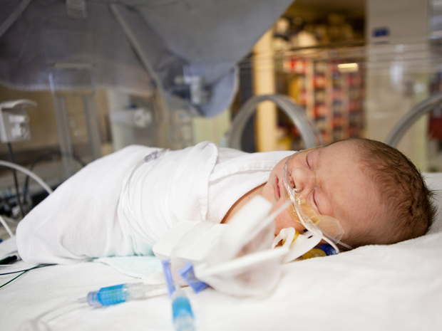 Newborn infant in the nursery.