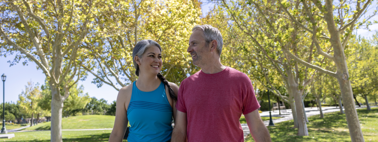 A couple prepares a healthy meal at home.