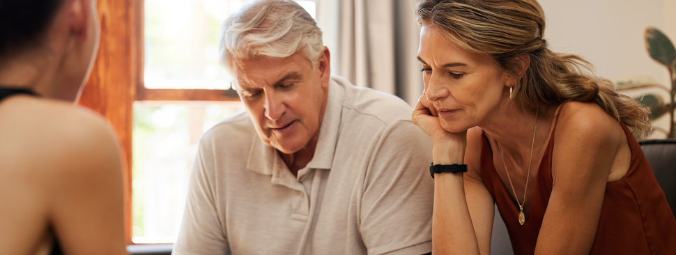 mature couple meeting with a financial advisor