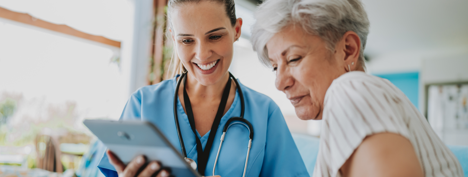 Provider smiles while supporting patient.