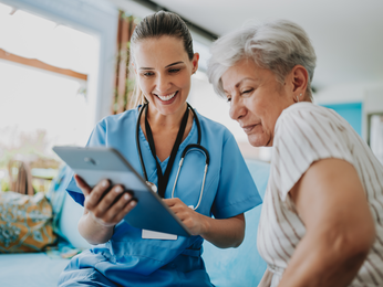 Patient and provider looking at a tablet