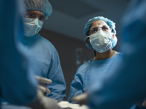 Orthopedic surgeon and staff in surgery