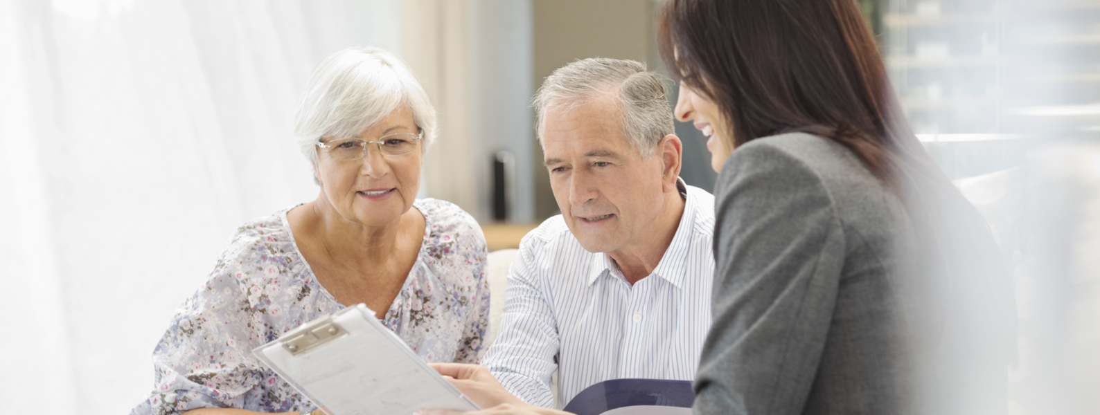 Couple speaking with tax advisor