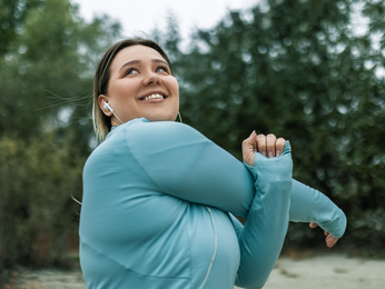 Young woman stretching before exercise