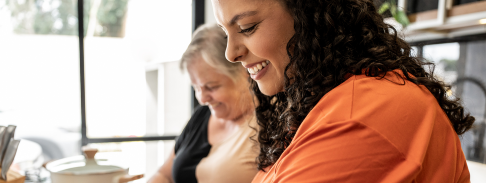 Mother and daughter cooking together