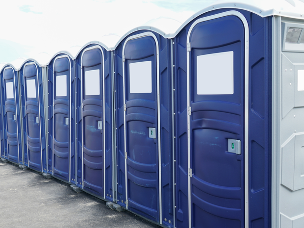 Line of blue porta potties