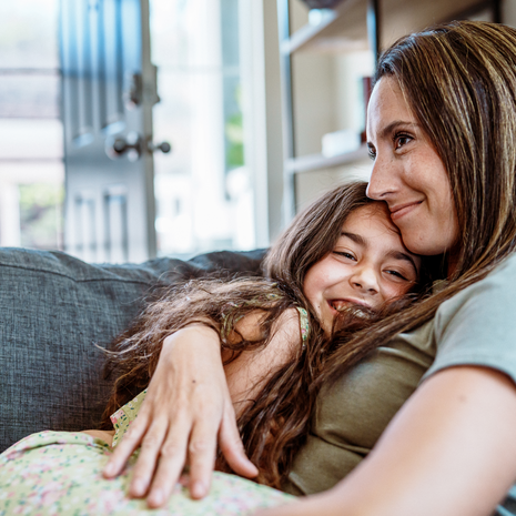Mother and daughter hugging each other