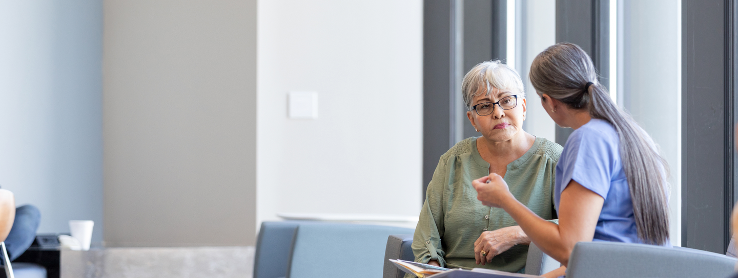 Older woman patient with surgeon