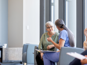 Woman talking with surgeon