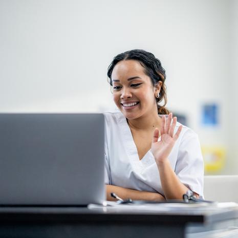 woman holds a positive pregnancy test