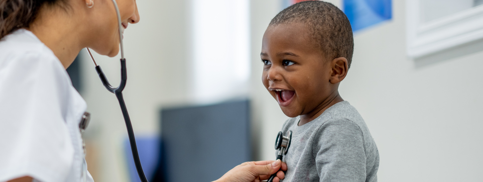 young boy gets his heart checked by a pediatrician