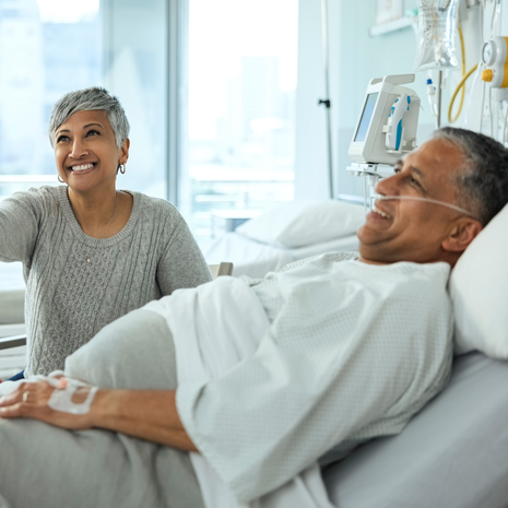 Senior couple with doctor after surgery