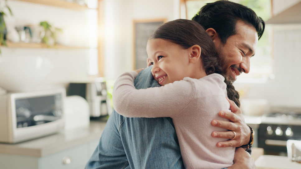 Father hugs daughter