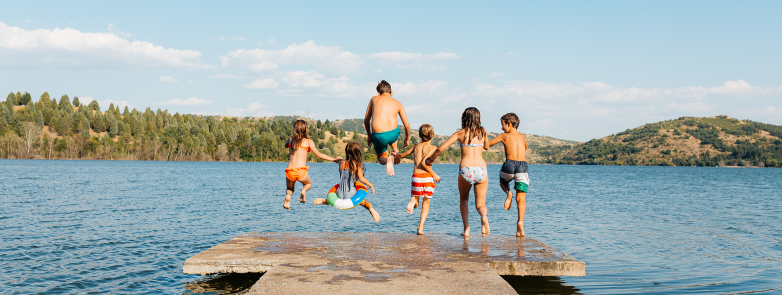Group of pre-teens playing on a dock