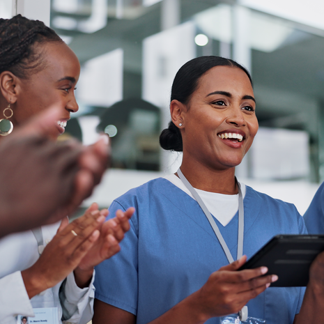 happy nurse talking to colleagues