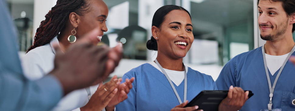 Medical team celebrating colleagues success