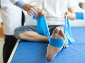 Physical therapist working with patient