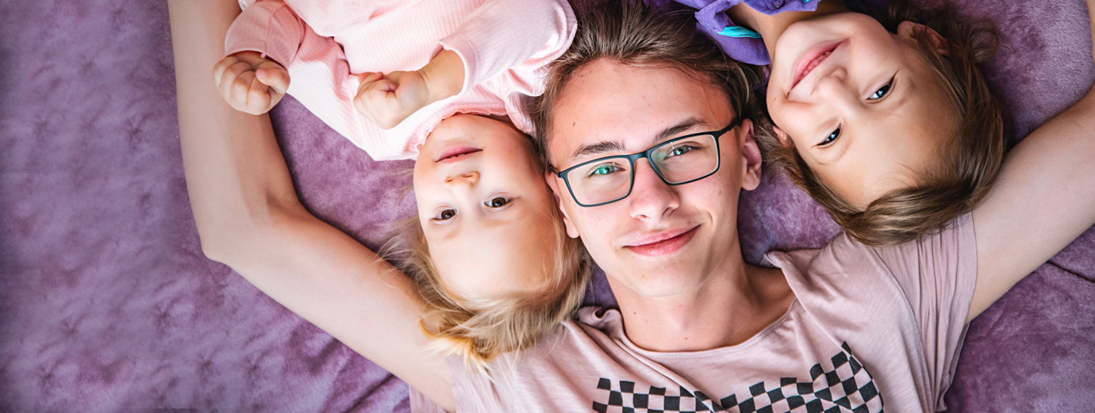 Young babysitter with children.