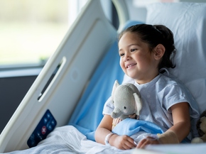 young girl in hospital bed