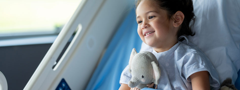 young girl in hospital bed