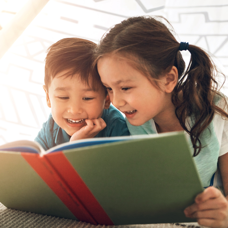 siblings reading together