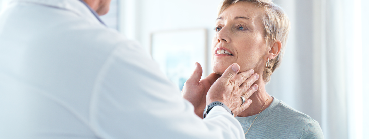 Doctor consulting with female patient during medical examination