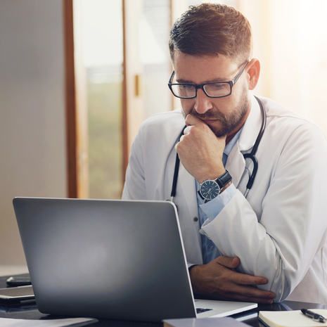 Doctor looking at a laptop