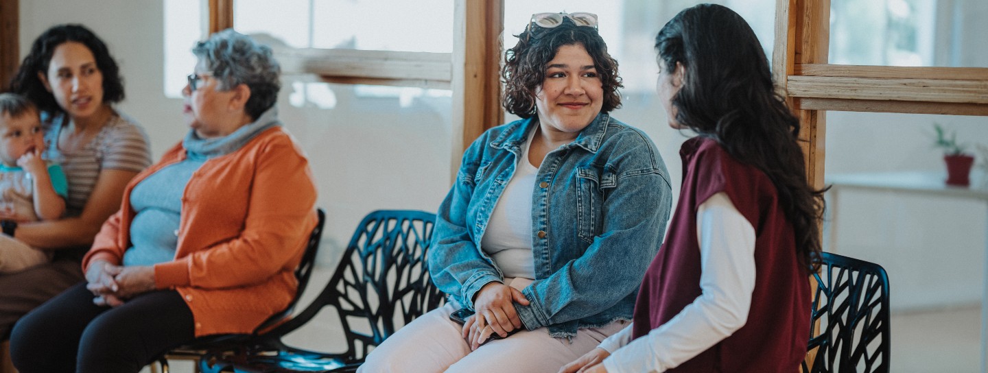 Group of patients sit in the waiting room of a doctor's office