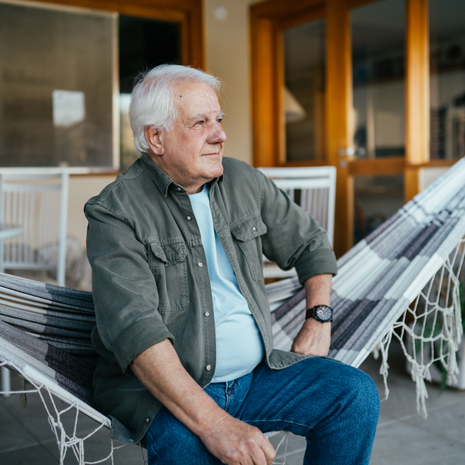 senior man sitting on his porch