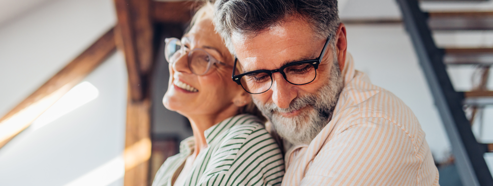 A couple embraces warmlly