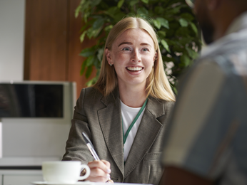 Woman at desk having discussion