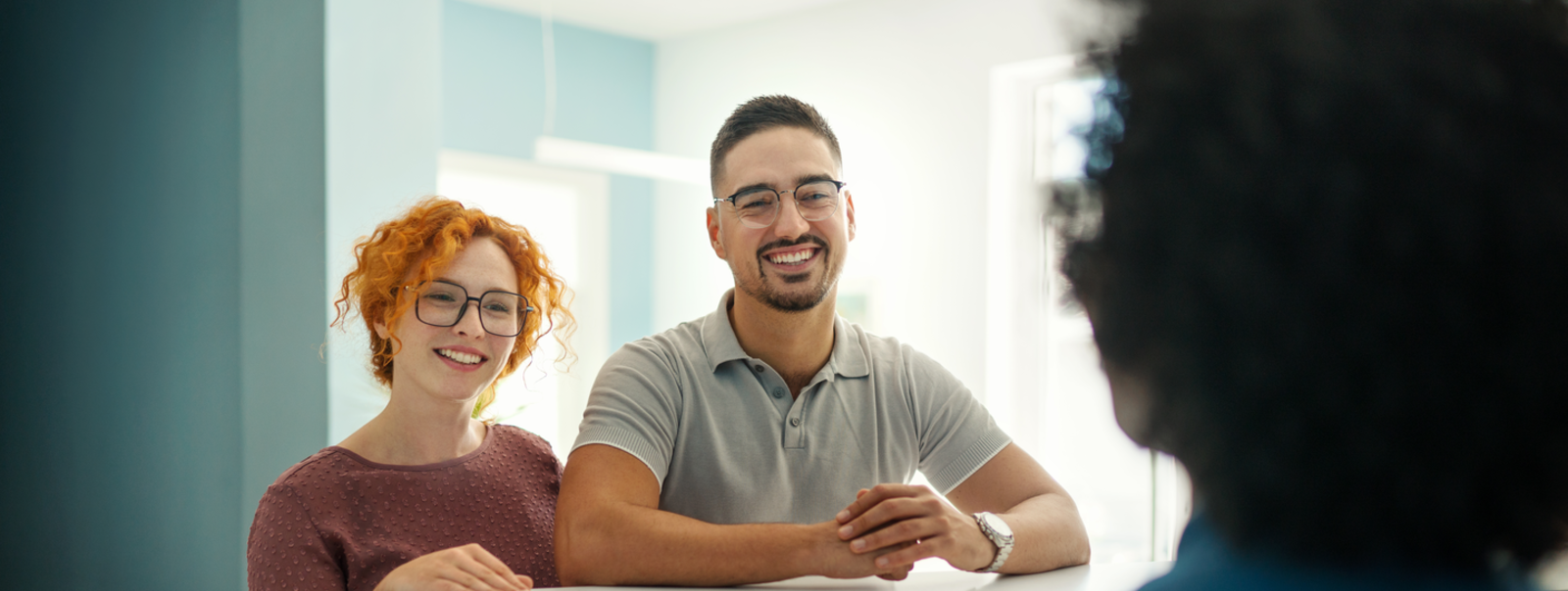 Young couple at the reception desk.